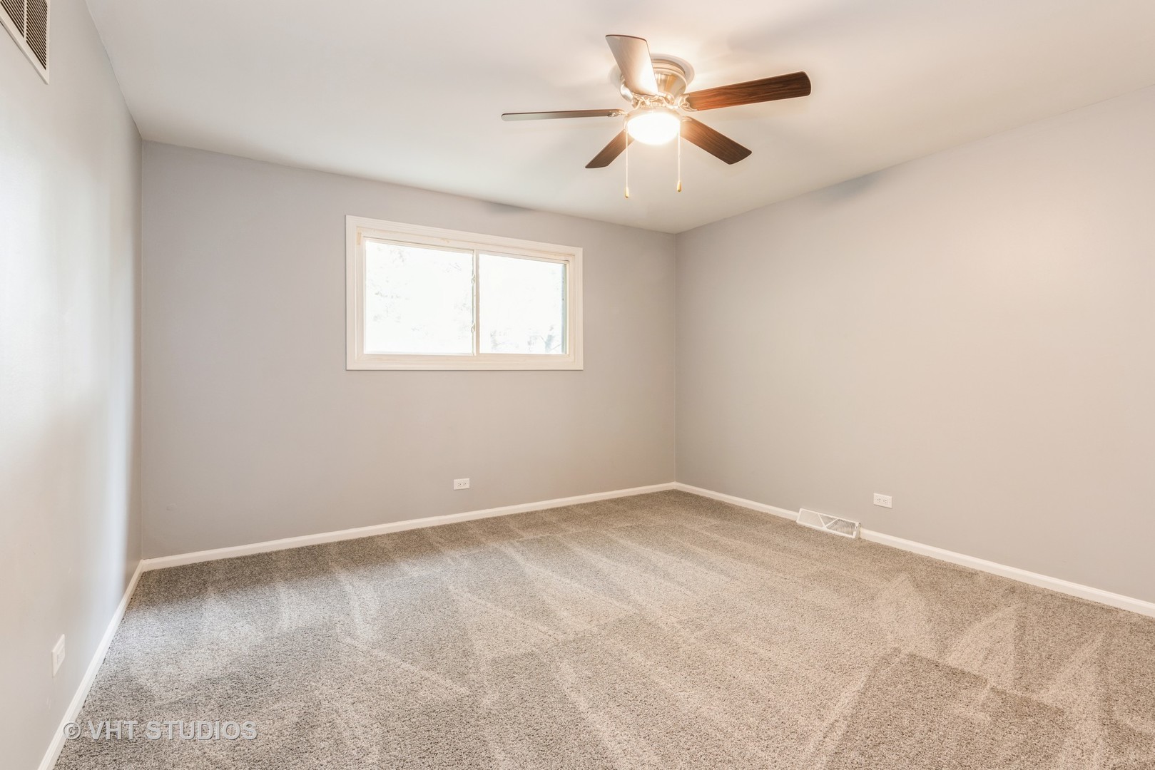 15117 Madison Avenue Dolton, IL 60419 - Photo 8 of 14 an empty room with a window and a fan