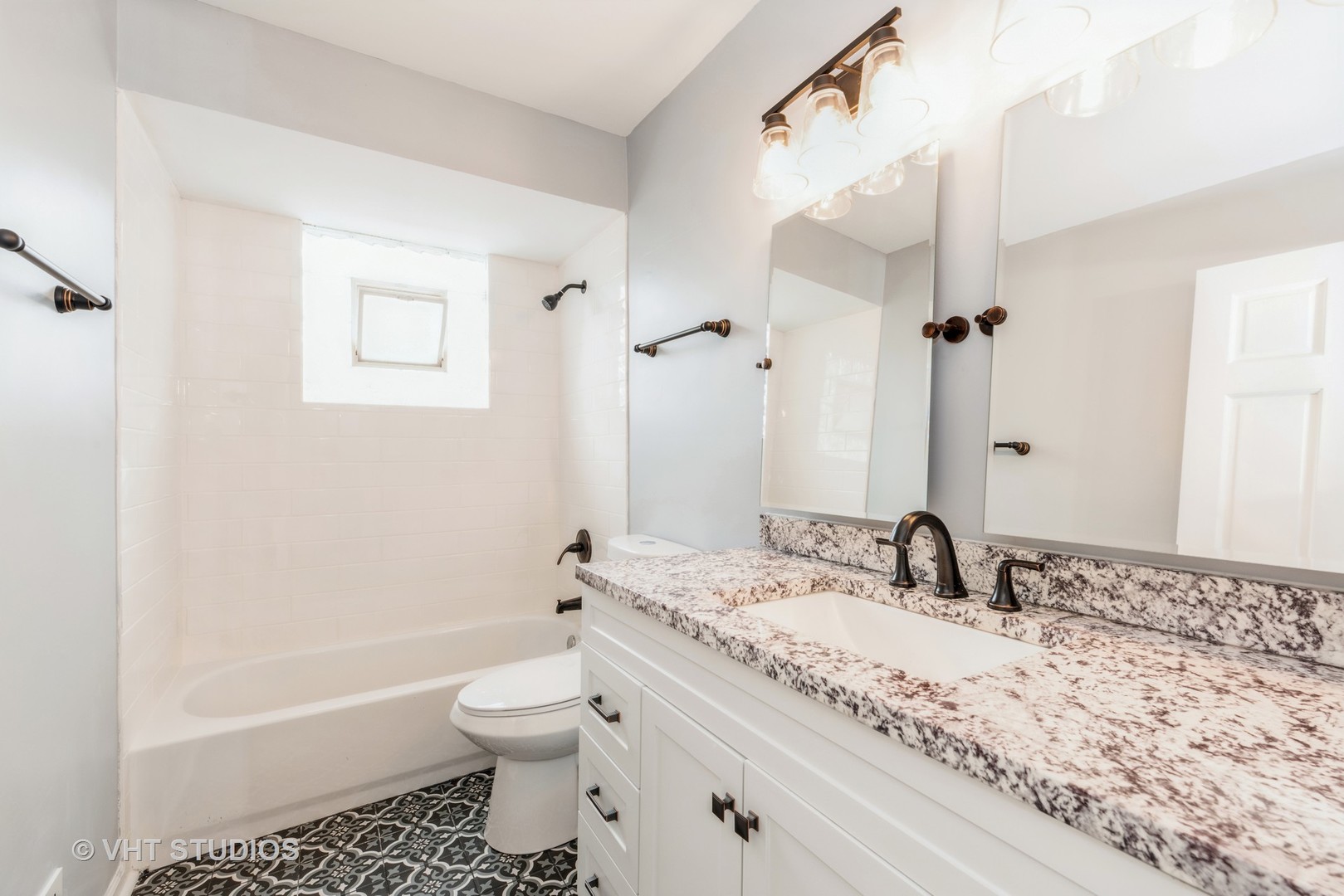 15117 Madison Avenue Dolton, IL 60419 - Photo 10 of 14 a bathroom with a granite countertop sink a toilet and a bathtub