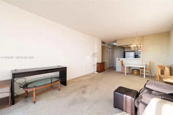 a living room with furniture and a piano