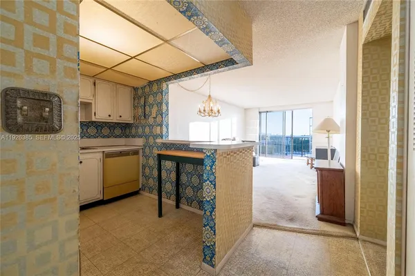 a kitchen with a refrigerator and a stove