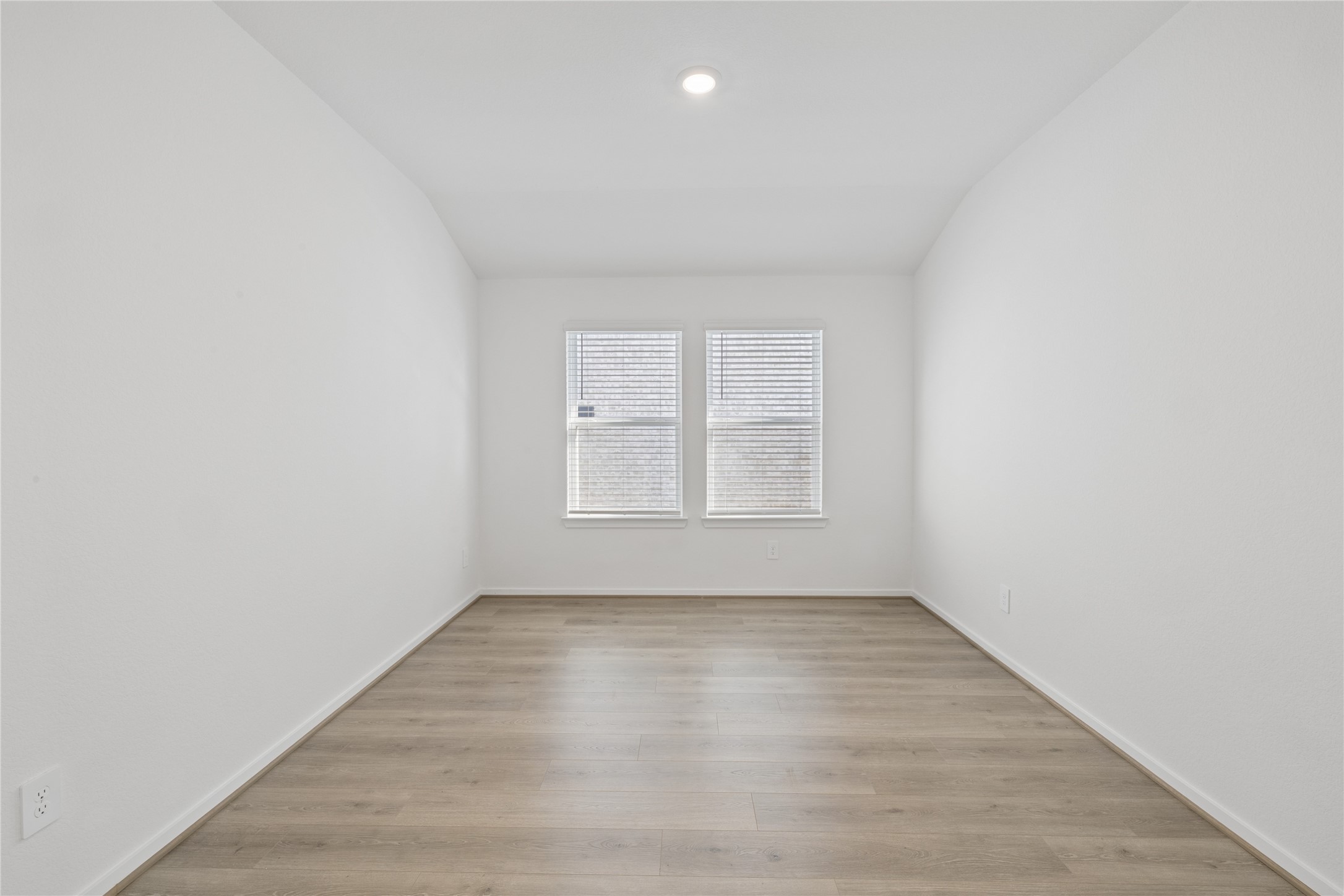 1697 Hopson Ranch Drive Conroe, TX 77301 - Photo 9 of 26 Bright, spacious room with sleek hardwood flooring and ample natural light from large windows.