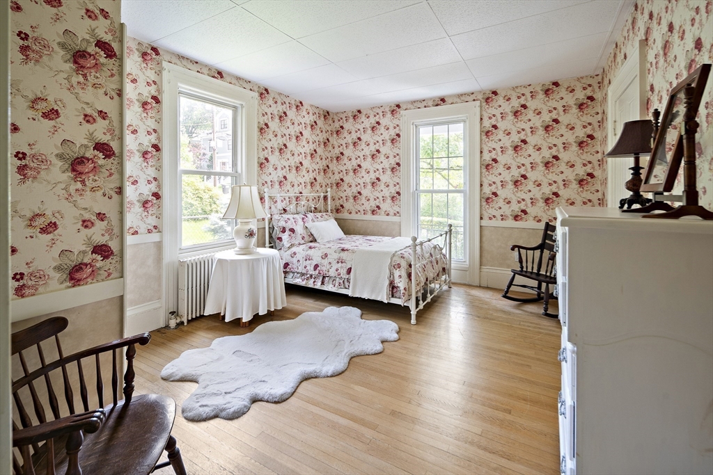 38 Spring Street Somerville, MA 02143 - Photo 11 of 37 a living room with furniture and a large window