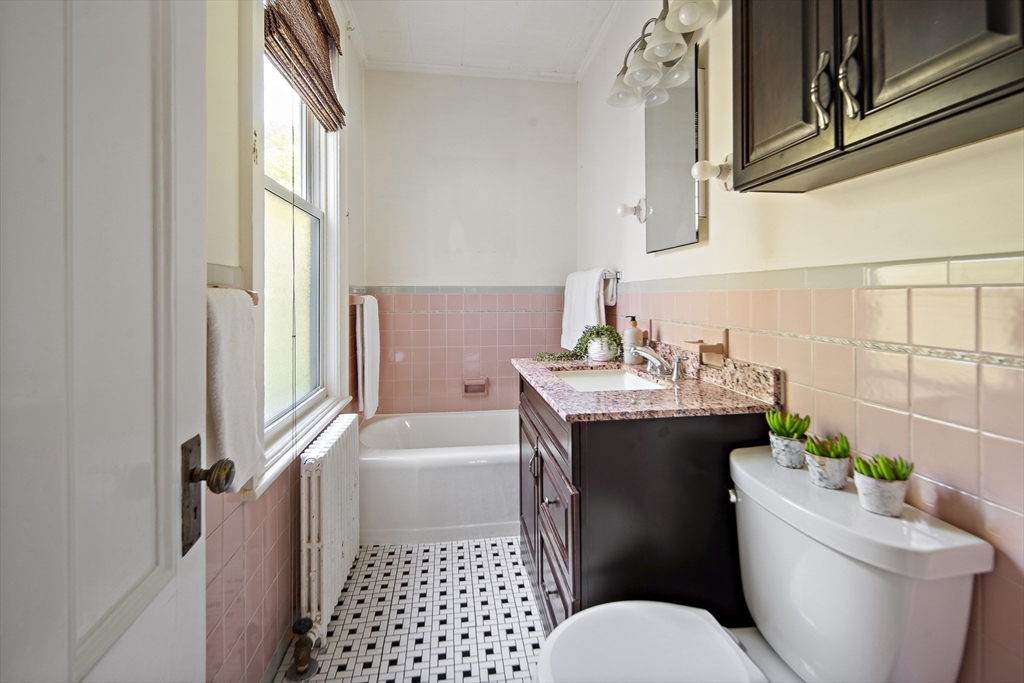 38 Spring Street Somerville, MA 02143 - Photo 14 of 37 a bathroom with a sink toilet and shower