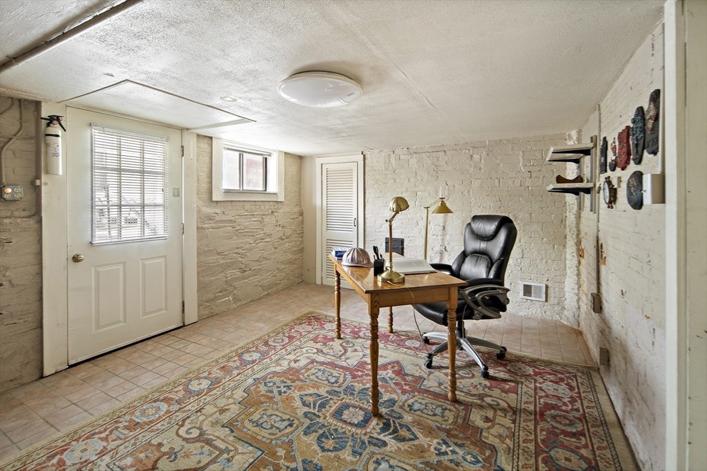 38 Spring Street Somerville, MA 02143 - Photo 15 of 37 a work room with furniture and windows