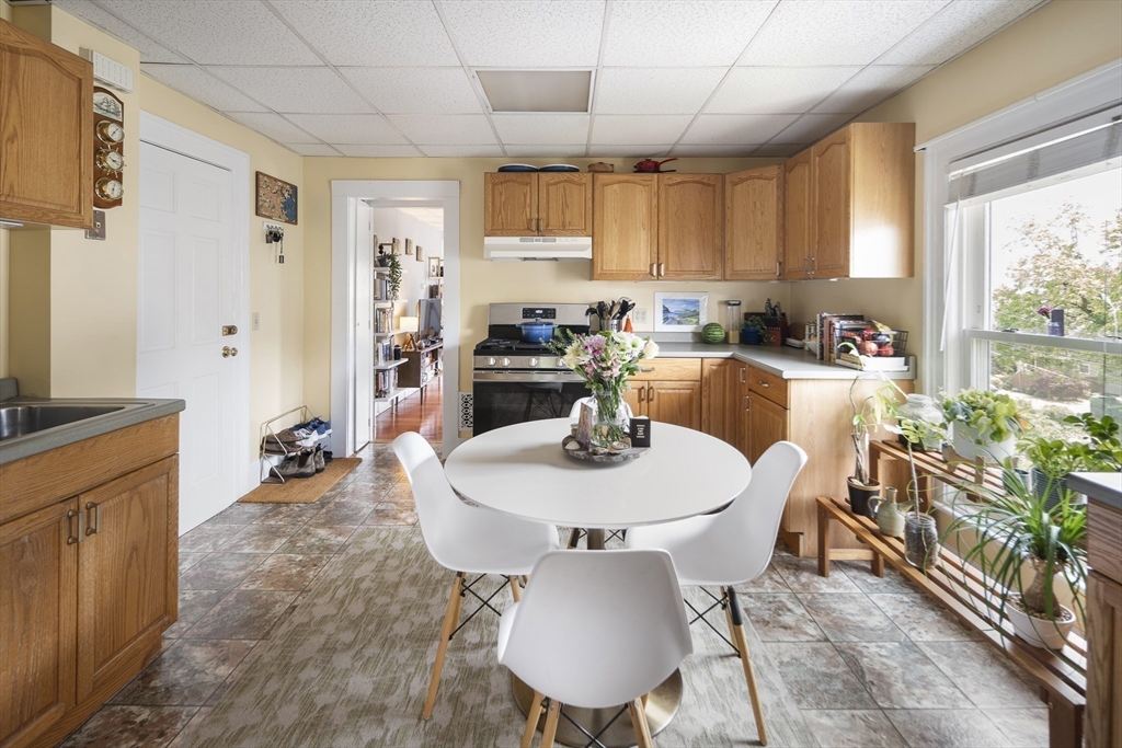 38 Spring Street Somerville, MA 02143 - Photo 18 of 37 a view of a dining room with furniture window and outside view