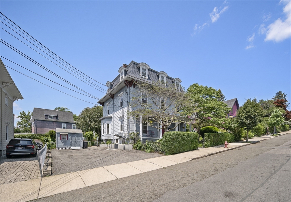 38 Spring Street Somerville, MA 02143 - Photo 2 of 37 a view of a building with a street