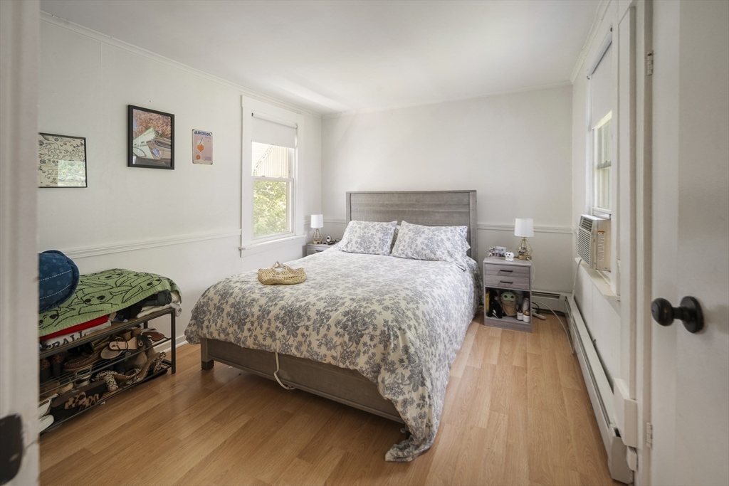 38 Spring Street Somerville, MA 02143 - Photo 24 of 37 a bedroom with a bed and a window