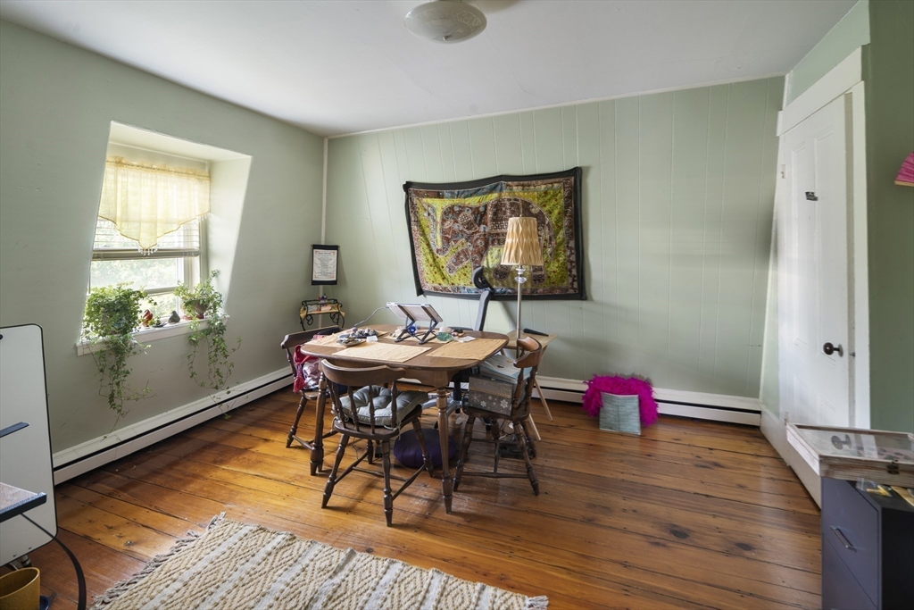 38 Spring Street Somerville, MA 02143 - Photo 28 of 37 a view of a dining room with furniture and wooden floor