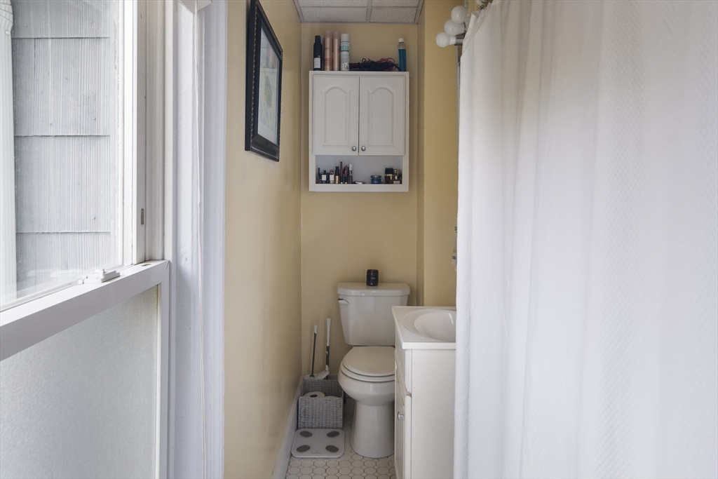 38 Spring Street Somerville, MA 02143 - Photo 29 of 37 a bathroom with a toilet and a shower