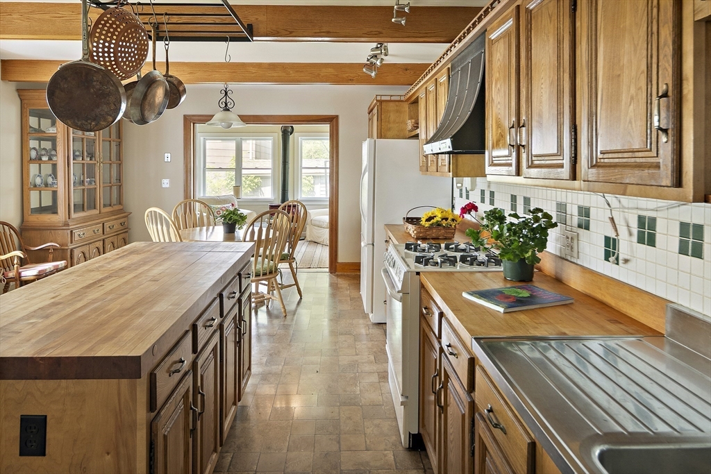 38 Spring Street Somerville, MA 02143 - Photo 7 of 37 a kitchen with a table and chairs