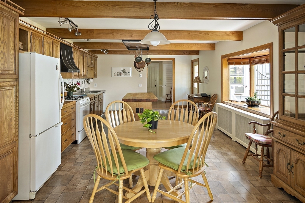 38 Spring Street Somerville, MA 02143 - Photo 8 of 37 a dining room with furniture a chandelier and wooden floor