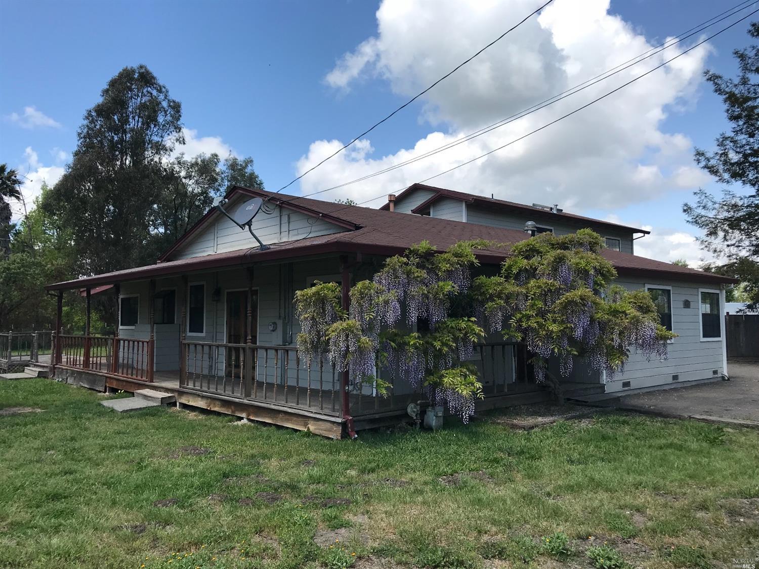 1451 South Wright Road Santa Rosa, CA 95407 - Photo 1 of 1 a view of a house with a small yard and a large tree