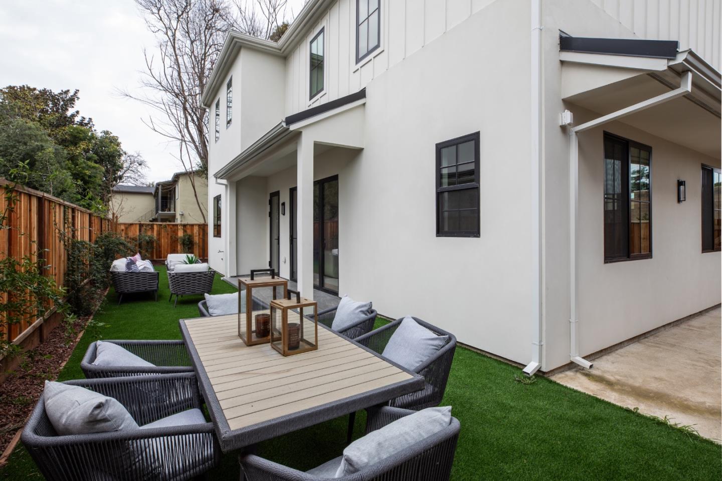 813 Bay Road Menlo Park, CA 94025 - Photo 20 of 23 a view of a patio with couches table and chairs and potted plants