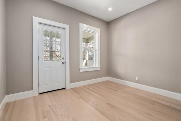 a view of an empty room with a window