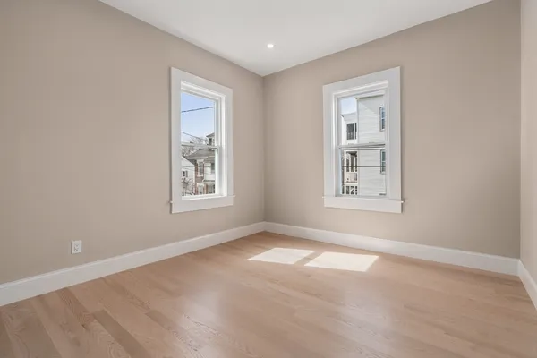 a view of an empty room with windows