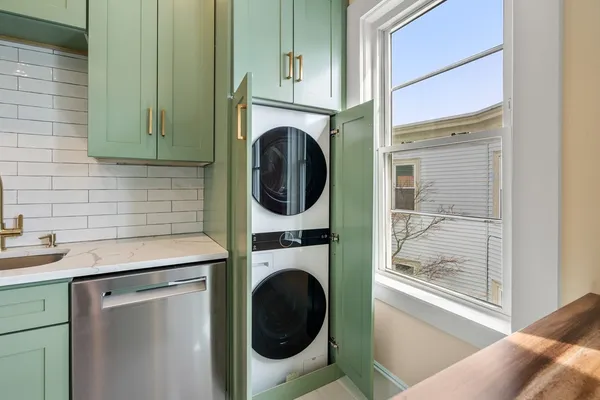 a utility room with dryer and washer