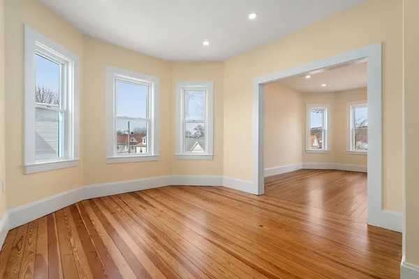 a view of livingroom with hardwood floor and hallway