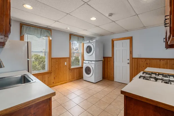 a kitchen with stainless steel appliances granite countertop a stove and a refrigerator