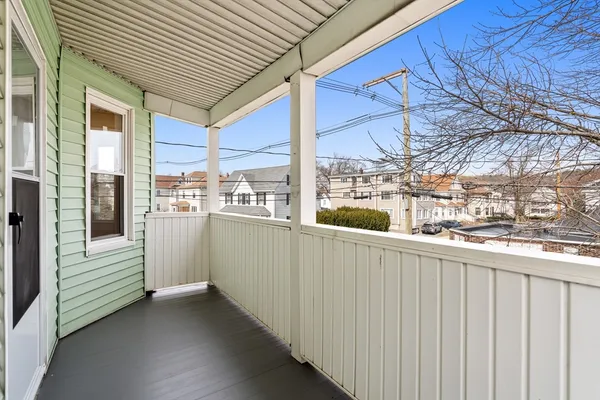 a view of a balcony with city view