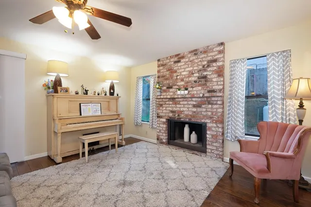 a bedroom with a bed a couch and a window