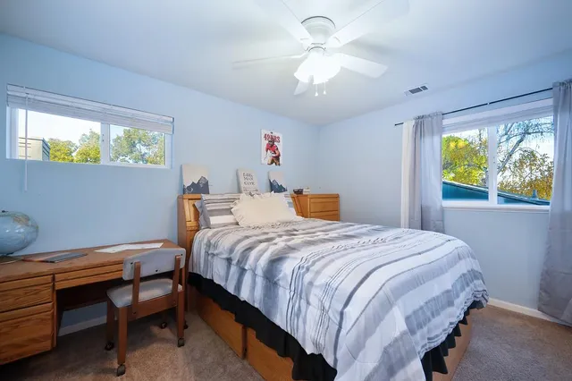 a bathroom with a double vanity sink toilet and shower