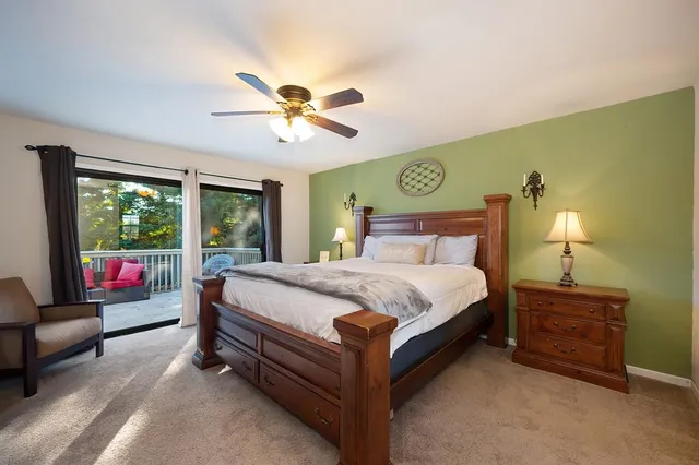 a patio with a table and chairs and a barbeque