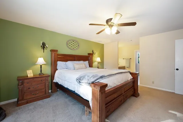 a view of a house with a backyard porch and sitting area