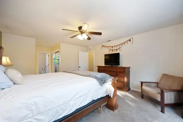 a view of a yard with a table and chairs in patio