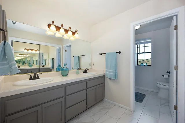 a view of a house with a yard porch and sitting area