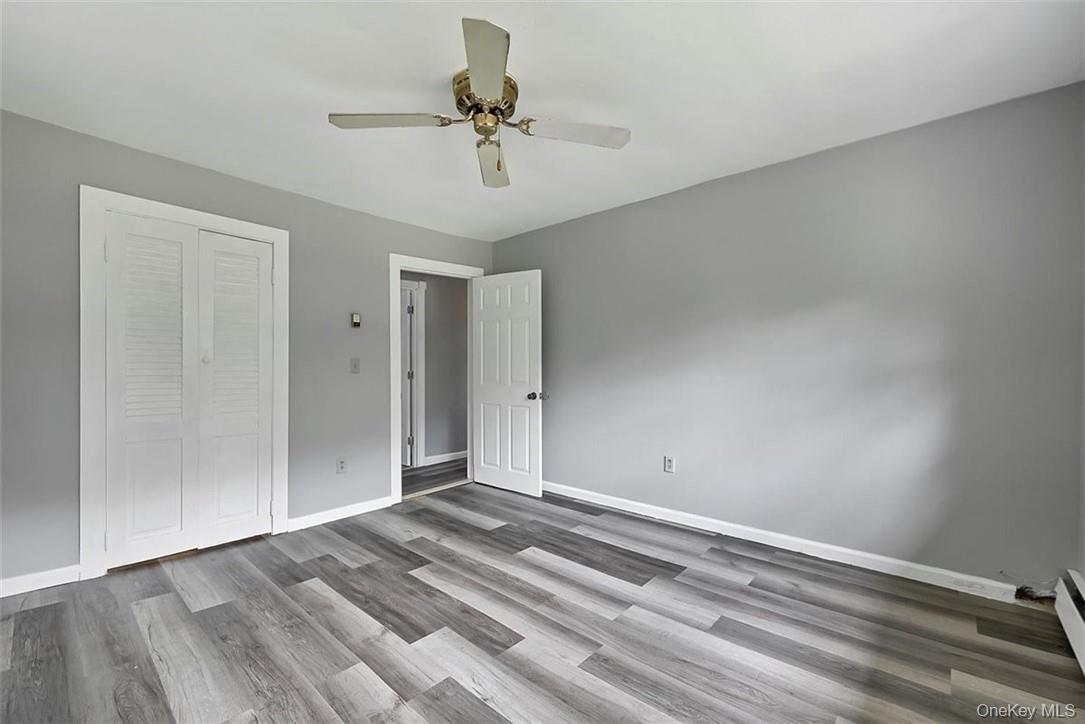 35 Peddler Hill Road Monroe, NY 10950 - Photo 10 of 23 Unfurnished bedroom with a closet, ceiling fan, and hardwood / wood-style floors