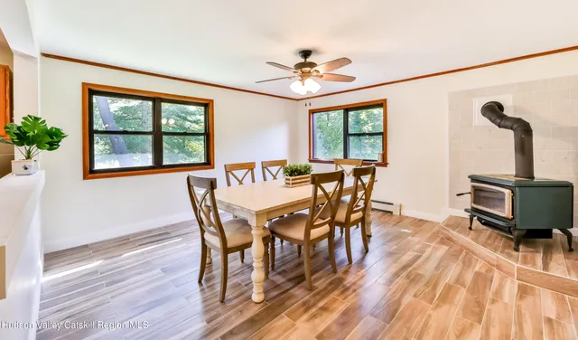 a view of a dining room with furniture window and outside view