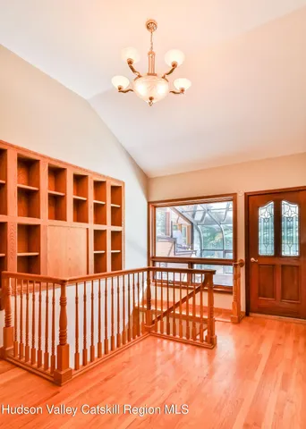 a view of a porch with a floor to ceiling window and an outdoor kitchen