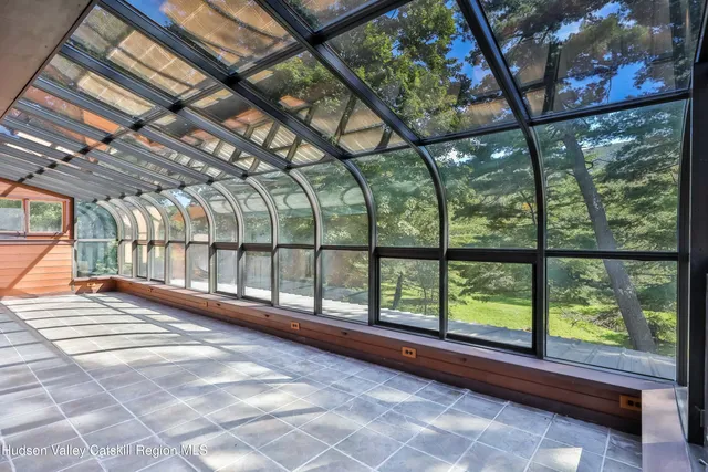 a view of an empty room with a large window