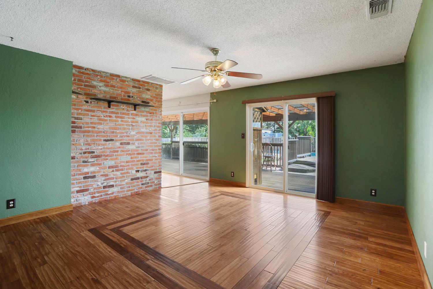 4592 West Woodbridge Road Lodi, CA 95242 - Photo 26 of 71 wooden floor in an empty room with a window