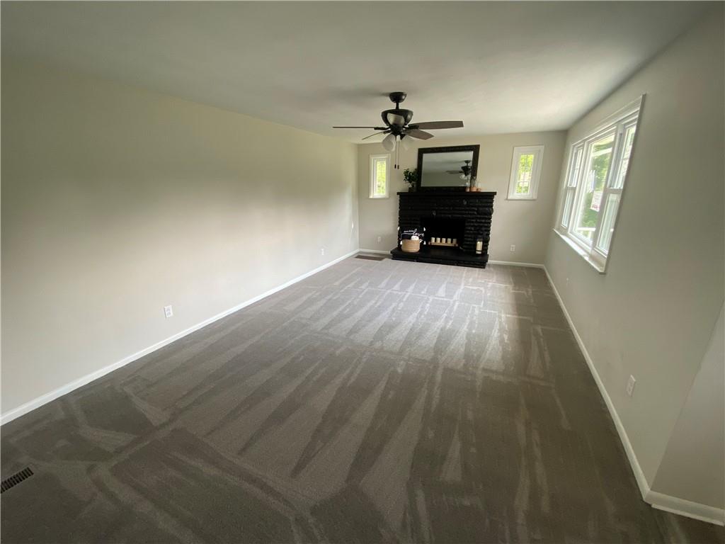 751 Lippencott Road Waynesburg, PA 15370 - Photo 4 of 14 a living room with furniture and a fireplace