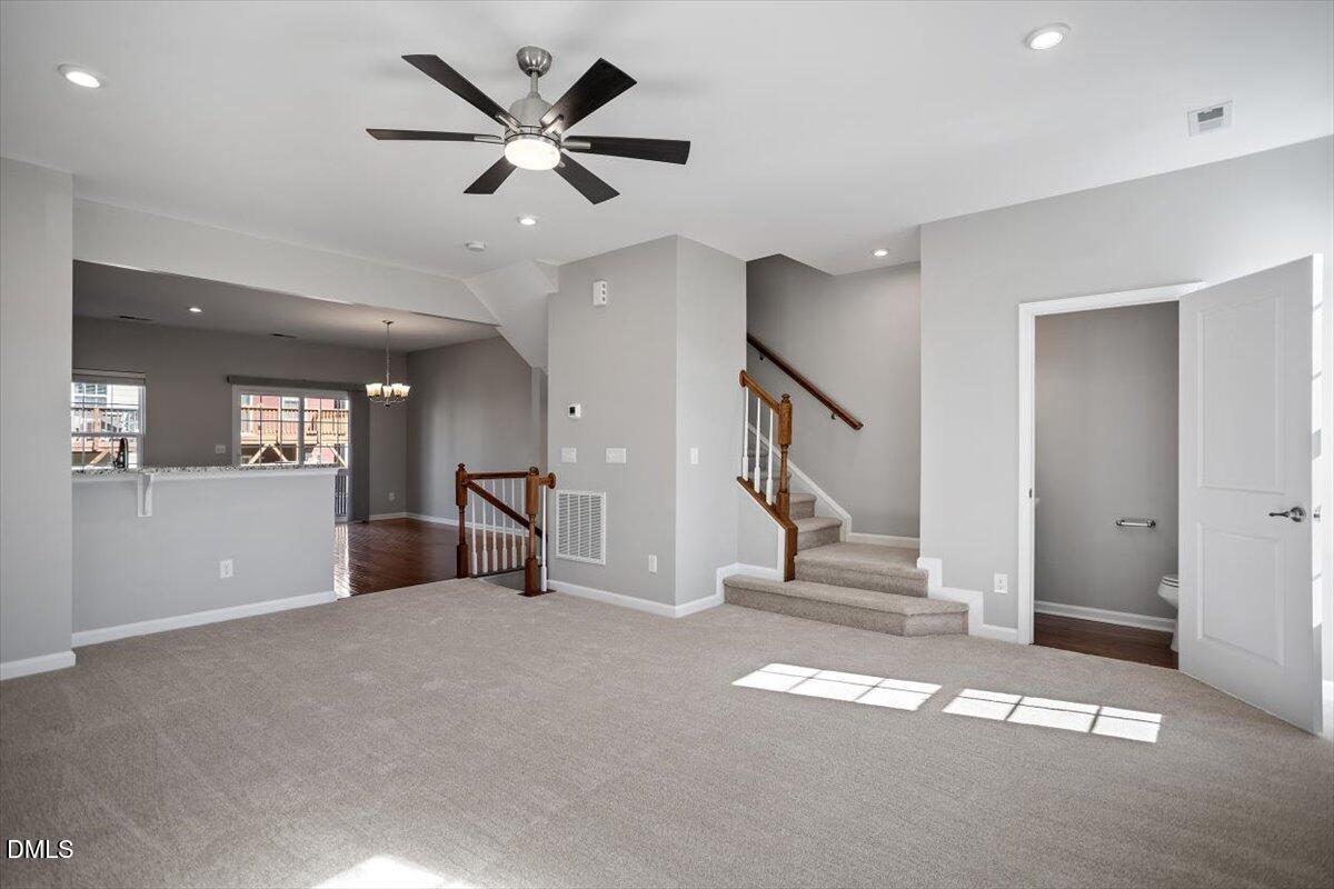 117 Brier Ridge Drive Durham, NC 27703 - Photo 16 of 29 a view of empty room with stairs and fan