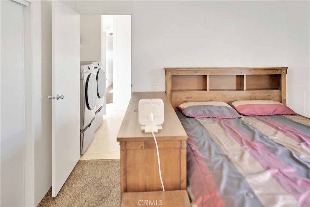 22601 Bear Valley Road, Unit 17 Apple Valley, CA 92308 - Photo 14 of 36 a bedroom with a bed and a table