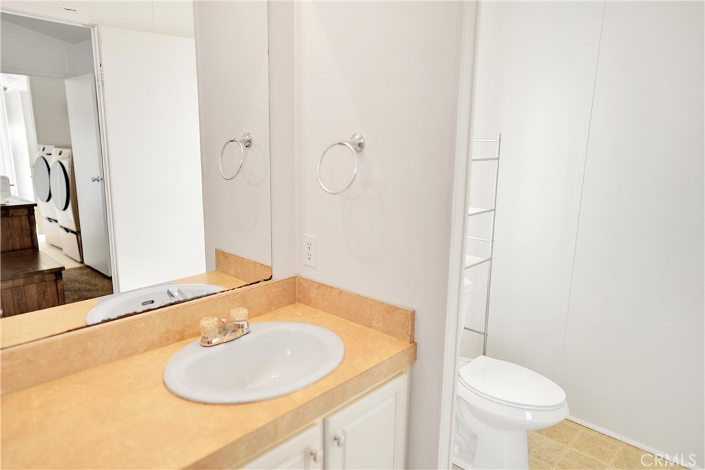 22601 Bear Valley Road, Unit 17 Apple Valley, CA 92308 - Photo 16 of 36 a bathroom with a sink toilet and shower