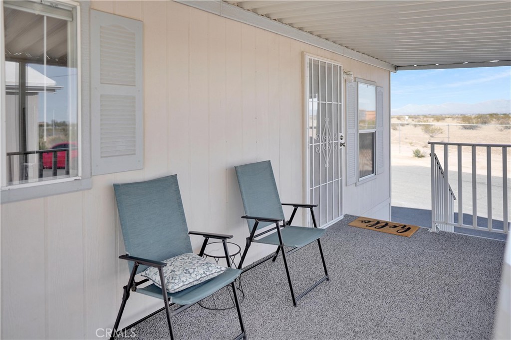 22601 Bear Valley Road, Unit 17 Apple Valley, CA 92308 - Photo 2 of 36 a view of a livingroom with furniture and a window