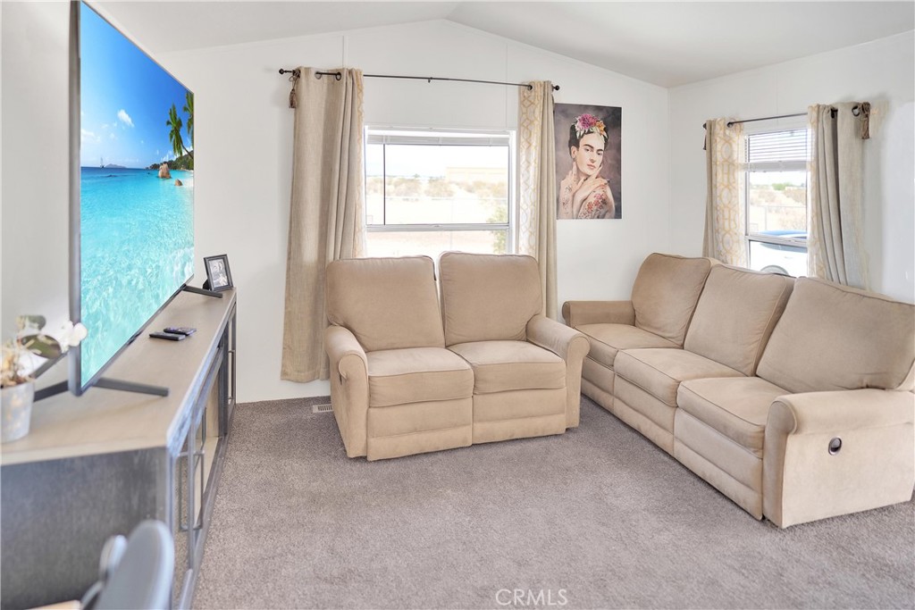 22601 Bear Valley Road, Unit 17 Apple Valley, CA 92308 - Photo 22 of 36 a living room with furniture and a window