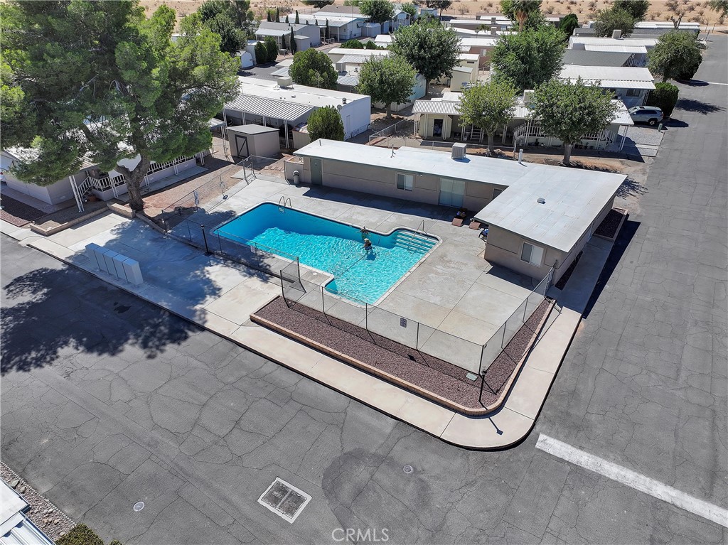 22601 Bear Valley Road, Unit 17 Apple Valley, CA 92308 - Photo 24 of 36 an aerial view of a house with a garden and patio