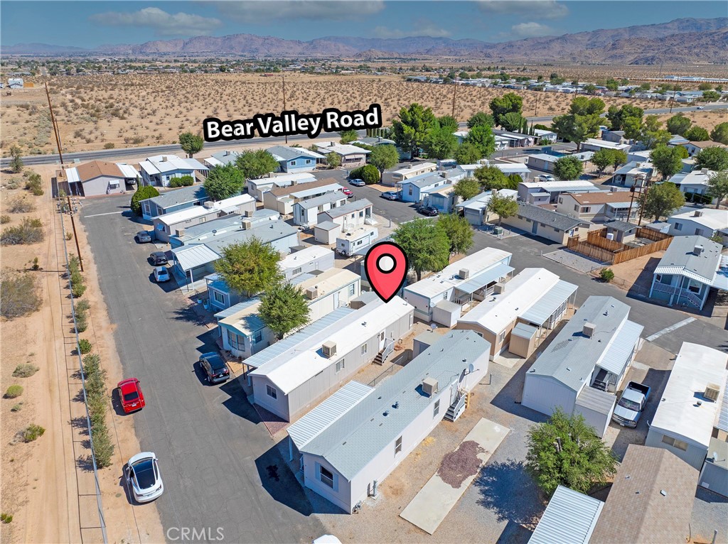 22601 Bear Valley Road, Unit 17 Apple Valley, CA 92308 - Photo 34 of 36 an aerial view of a parking space with lots of white furniture
