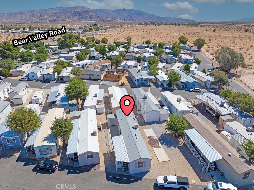 22601 Bear Valley Road, Unit 17 Apple Valley, CA 92308 - Photo 35 of 36 an aerial view of residential houses with outdoor space