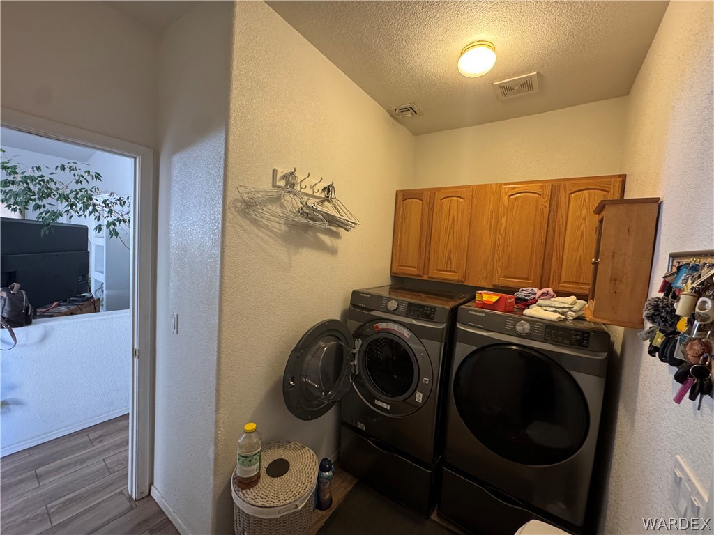 4029 Roma Road Kingman, AZ 86401 - Photo 36 of 90 This utility area features overhead cabinetry providing storage, a ceiling light fixture, and a ceiling vent