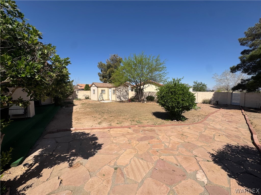 4029 Roma Road Kingman, AZ 86401 - Photo 49 of 90 The property features an extensive outdoor space with a flagstone patio and a large yard