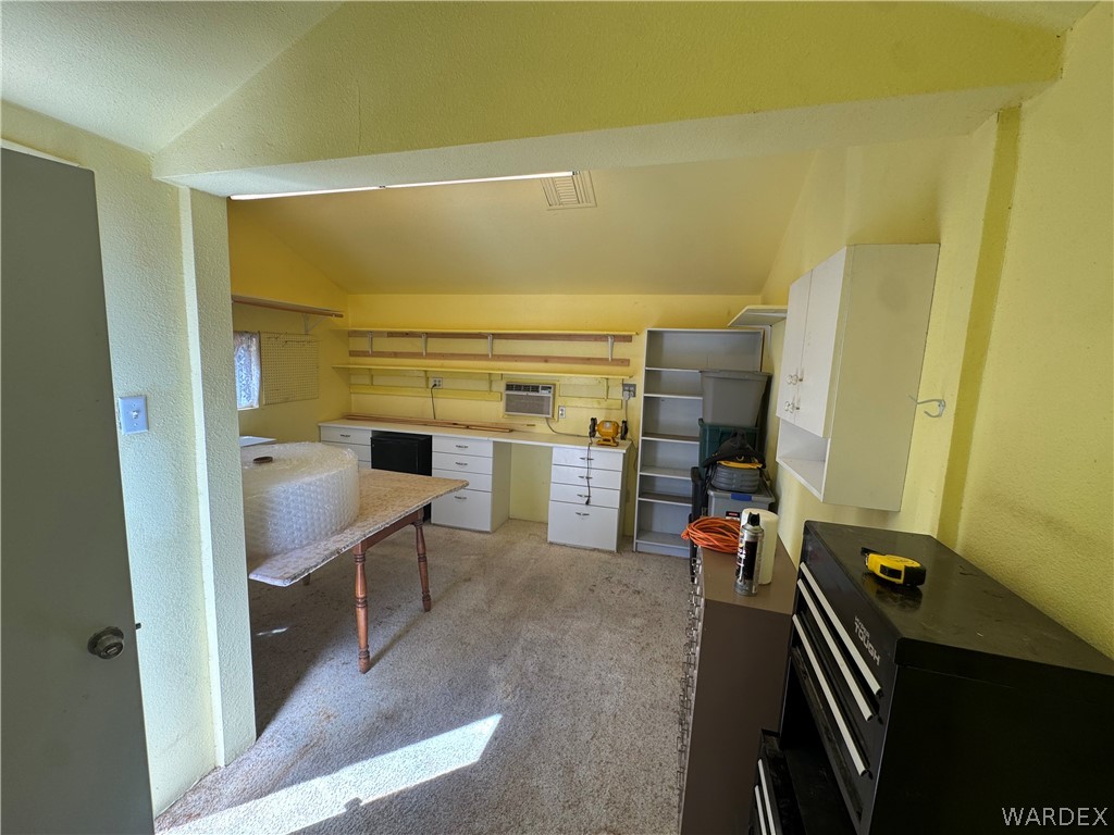 4029 Roma Road Kingman, AZ 86401 - Photo 72 of 90 This adaptable space features extensive wall shelving, built-in cabinetry, and a window unit