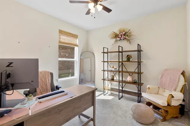 a workspace with furniture and window