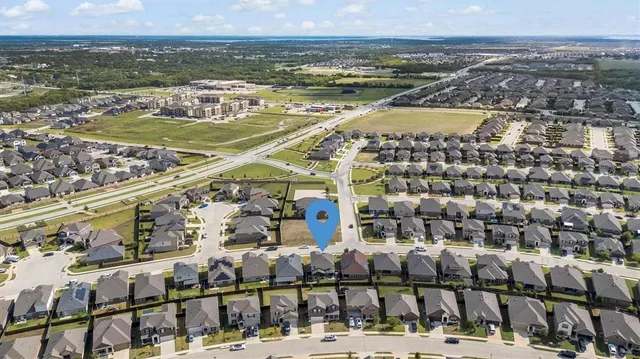 a view of a swimming pool with a yard
