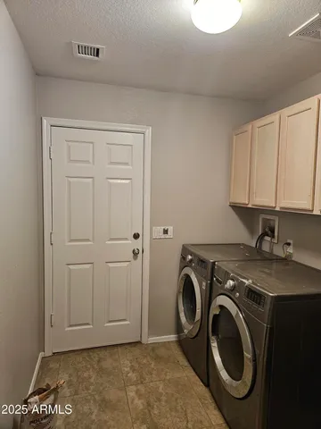 a view of a storage & utility room with washer and dryer