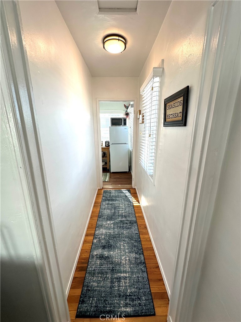 116 Avenida Serra, Unit 4 San Clemente, CA 92672 - Photo 11 of 23 a view of a hallway with wooden floor and staircase